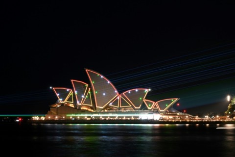 Laser beams illuminate the sails of the Sydney Opera House during celebrations to mark the building's 50th anniversary