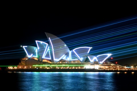 Laser beams illuminate the sails of the Sydney Opera House during celebrations to mark the building's 50th anniversary