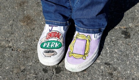 A fan wearing 'Friends'-themed shoes pays respects outside the Los Angeles house of actor Matthew Perry on October 29, 2023