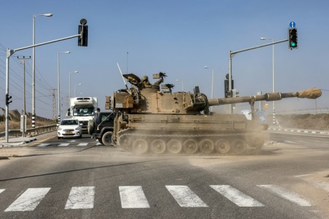 Flares descend on Gaza as Israeli warplanes pound the Palestinian territory