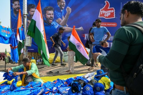 A street vendor sells India's cricket team caps and jerseys outside the Narendra Modi Stadium in Ahmedabad  