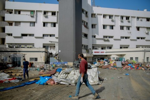 A Palestinian man walks near al-Shifa hospital in Gaza City on November 26