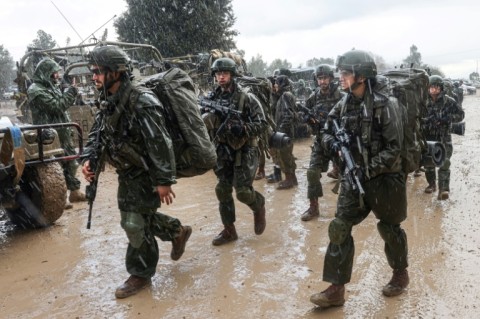 Israeli soldiers prepare to enter the Gaza Strip, near the border area in southern Israel