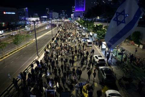 Relatives and supporters of hostages held by Palestinian militants demonstrate outside the Israeli defence ministry in Tel Aviv