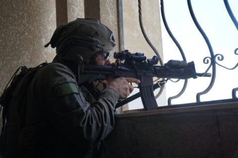 This handout picture released by the Israeli army on December 21, 2023 shows a soldier operating in the Gaza Strip