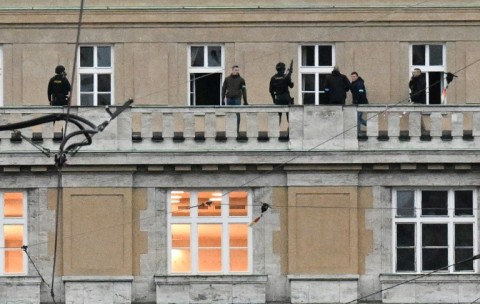 Armed police on a balcony of the Charles University in central Prague after the shooting