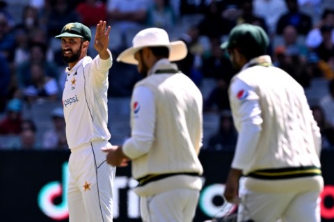 Pakistan captain Shan Masood (L) gestures to his players on the fourth day of the second cricket Test match against Australia