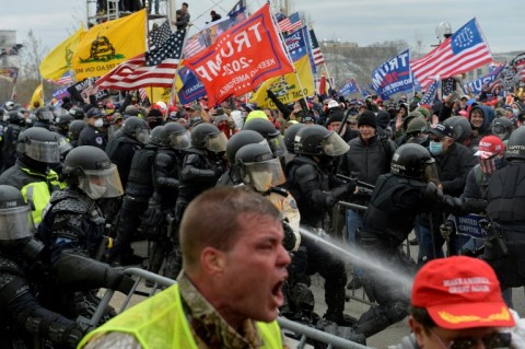 Trump supporters clash with police and security forces as people try to storm the US Capitol in Washington D.C on January 6, 2021