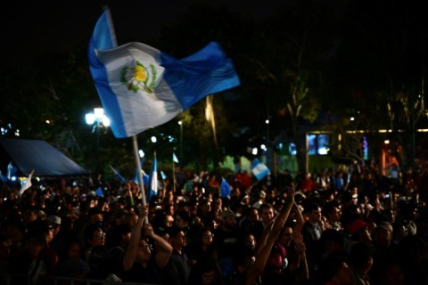 Thousands of supporters gathered to await the ceremony, waving flags, after some earlier protested the delays outside Congress