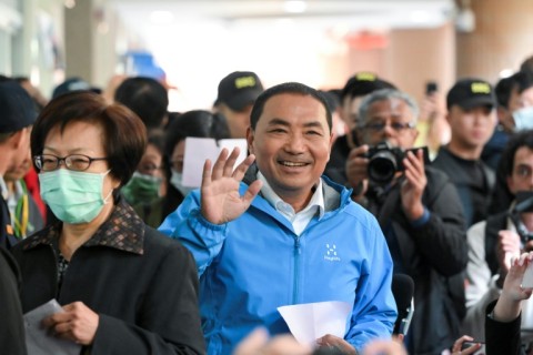 Taiwan presidential candidate Hou Yu-ih of the main opposition Kuomintang (KMT) party arrives to cast his ballot