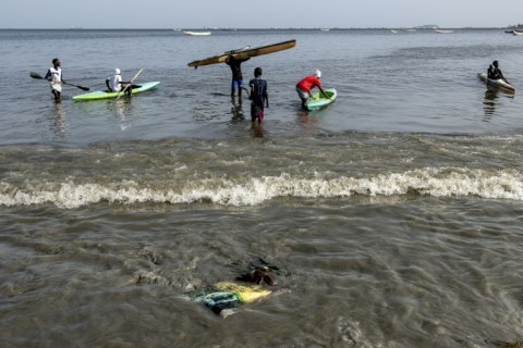 The water pollution doesn't deter all beachgoers from wading in