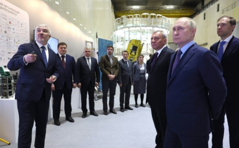 A pool photograph distributed by Russian state owned agency Sputnik shows President Vladimir Putin visiting the Rocket and Space Corporation  Energia, near Moscow, on October 26, 2023