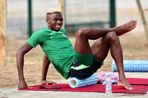 Napoli striker Osimhen does some stretches during a Nigerian training session in Abidjan on Monday