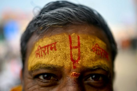 A devotee with his forehead marked with the name of the Hindu god Ram in Ayodhya: among the celebrity guests due at the opening are Indian tycoons, former national cricket captain Virat Kohli and Bollywood titan Amitabh Bachchan