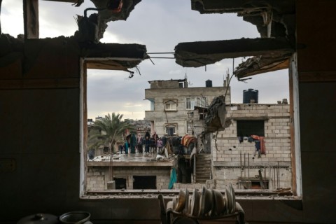 Palestinians carry their belongings as they flee Khan Yunis in the southern Gaza Strip