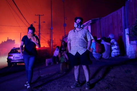 The fires have enveloped Valparaiso in a thick mushroom cloud of smoke