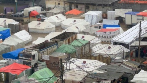 Makeshift tents flooded by heavy rain in Rafah