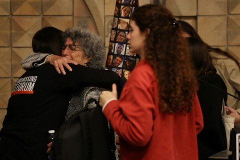 Former hostage Adina Moshe receives support from a woman, following a conference organised by five women who were abducted by the Palestinian Hamas movement on October 7, 2023 and later released during a seven-day truce