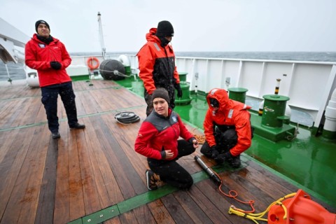 Colombian researcher Andrea Bonilla checks one of the hydrophones used to listen to life in the deep