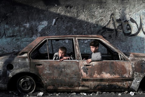 A destroyed car in Rafah, where Israeli strikes have occurred ahead of a mooted Israeli ground operation