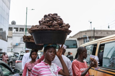 At the market outside the mosque, traders say they are also struggling