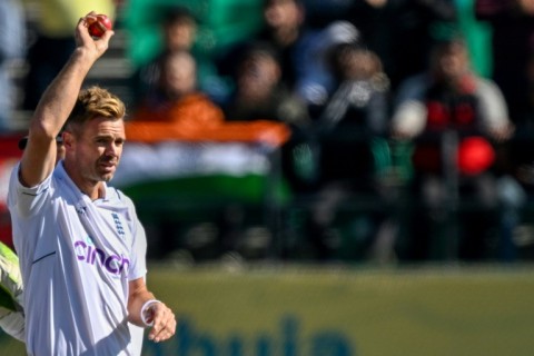 Anderson raised the ball to the crowd against the backdrop of the Himalayas as teammates gathered around him and England fans stood up to cheer