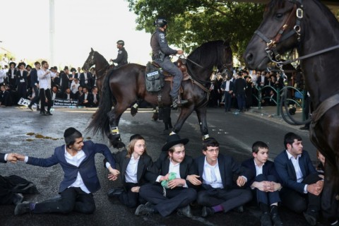 Ultra-Orthodox Israelis have been protesting efforts to remove their long-standing exemption from military service