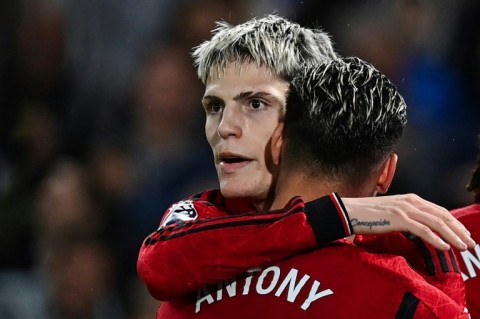 Manchester United's Alejandro Garnacho (left) celebrates his second goal against Chelsea at Stamford Bridge