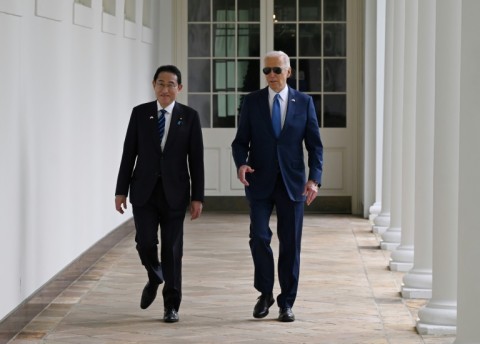 US President Joe Biden and Japanese Prime Minister Fumio Kishida walk along the colonnade of the White House in Washington, DC, on April 10, 2024. 