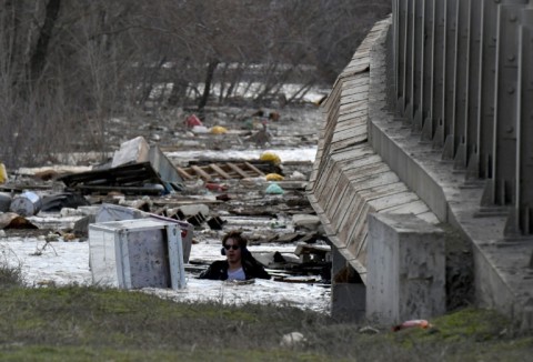 A man makes his way in a flooded area of the Russian city of Orenburg