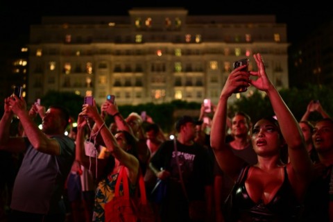 Fans arrive at Copacabana beach for a free concert by Madonna in Rio de Janeiro