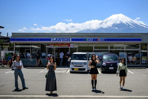 Local officials and residents say while the town welcomes visitors, they need to stop tourists from continuously crossing the street, ignoring red lights and littering