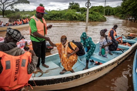 Motorboats are in constant demand as they cart people and supply desperately needed food