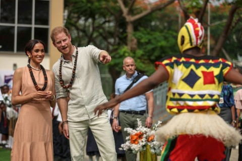 The couple were greeted at a school in Abuja by a drum and dance group from the Igbo ethnic group