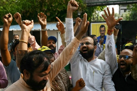 Crowds gathered at the headquarters of Kejriwal's Aam Aadmi Party after the ruling to celebrate his impending release with the customary distribution of sweets