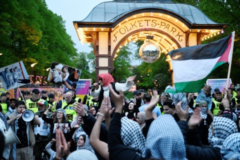 Police pushed back protesters outside the arena where more than a hundred demonstrators waved flags and chanted 'Free Palestine'