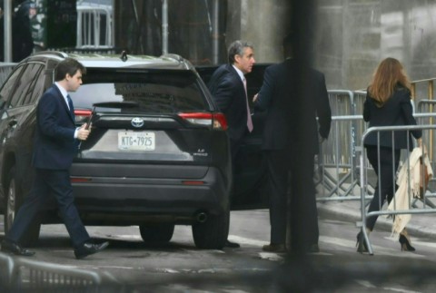 Former Trump attorney Michael Cohen (C) arrives at Manhattan Criminal Court for the trial of former US President Donald Trump for allegedly covering up hush money payments linked to extramarital affairs