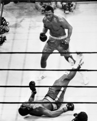 Joe Frazier stands over Muhammad Ali at  Madison Square Garden after scoring the only knockdown in their three fights