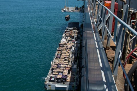 US CENTCTOM picture shows Gaza-bound aid lifted by crane at the Ashdod port in southern Israel