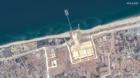 A handout satellite image courtesy of Maxar Technologies shows the US-built Trident Pier on the Gaza coast lined up nearby