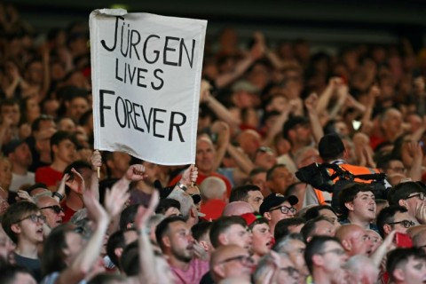 Liverpool fans hold a banner reading "Jurgen Lives Forever" 