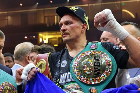 Ukraine's Oleksandr Usyk celebrates his victory over Britain's Tyson Fury for the undisputed heavyweight world title