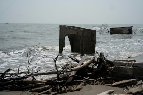 Homes destroyed by the sea are seen in the community of El Bosque in southern Mexico