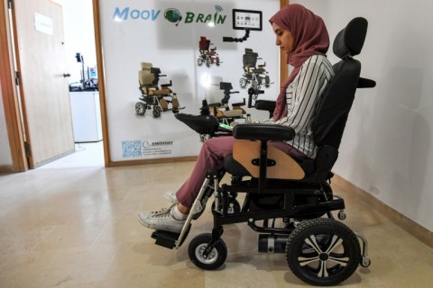 Tunisian engineer Souleima Ben Tamime tests a prototype of her team's new wheelchair system