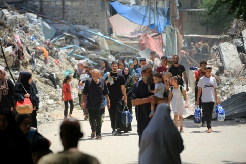 Gazans flee Bureij refugee camp, near Nuseirat, fearing Israeli bombardment