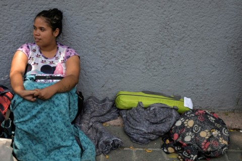 Venezuelan migrant Carmen Chacon waits outside a migrant shelter in Mexico City