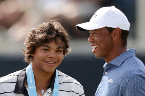 Tiger Woods, right, and son Charlie, left, share a laugh on the 18th green during dad's practice round for the 124th US Open at Pinehurst