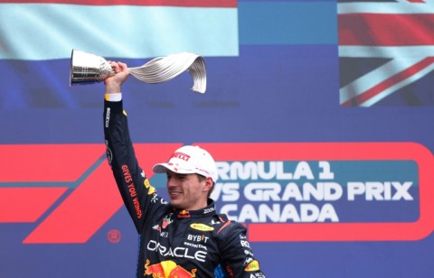 Max Verstappen brandishes his trophy in Montreal