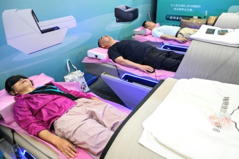 Internet-connected sleep monitors, robotic arms and calorie-counting cafeteria plates were on display at an elder care industry fair in Shanghai