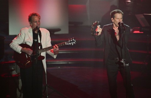 Kevin Bacon (R) and his brother singer-songwriter Michael Bacon perform "Footloose" during the Songwriters Hall of Fame